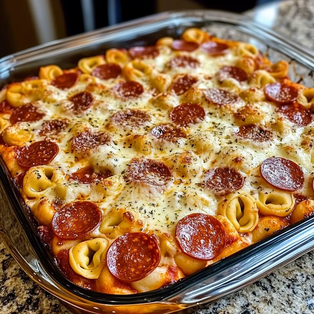 Tortellini pizza bake Pepperoni pasta casserole Cheesy tortellini bake Pizza tortellini casserole Pepperoni cheese pasta bake Tortellini pepperoni dinner Baked tortellini casserole